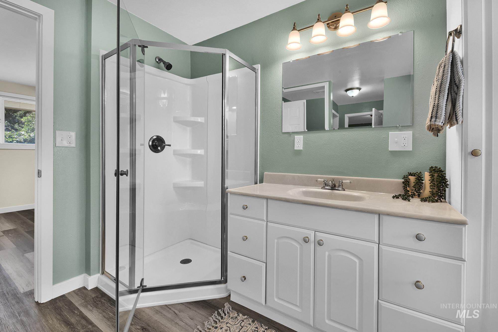 5755 Chuckwagon Road Nampa, ID 83686 - Photo 25 of 50 White vanity with an integrated sink and light-toned countertop