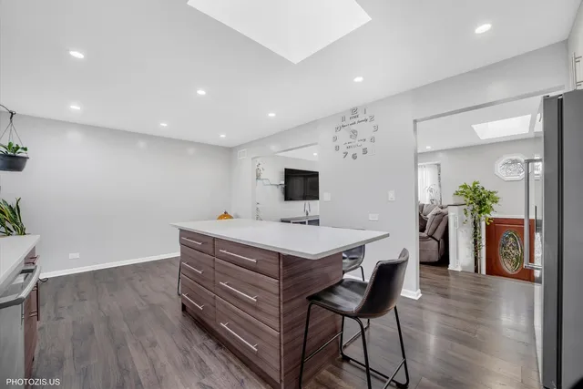 a kitchen with a table and chairs in it