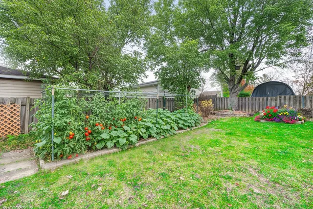 a view of a house with a backyard porch and sitting area