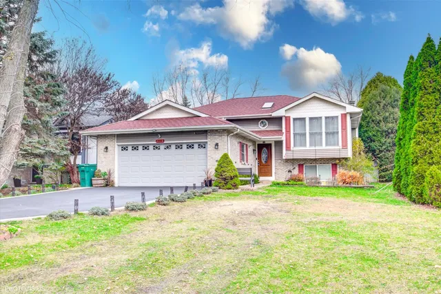 an aerial view of a house with a yard and a garden