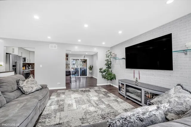 a living room with furniture and flowers