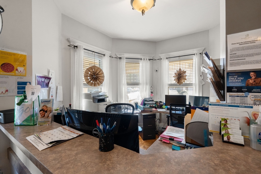 826 Broadway Everett, MA 02149 - Photo 11 of 41 a room with furniture and a window