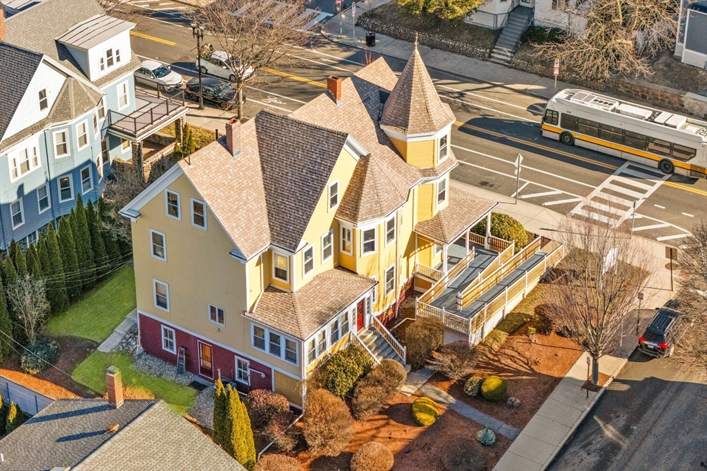 826 Broadway Everett, MA 02149 - Photo 2 of 41 aerial view of a house with a yard and potted plants