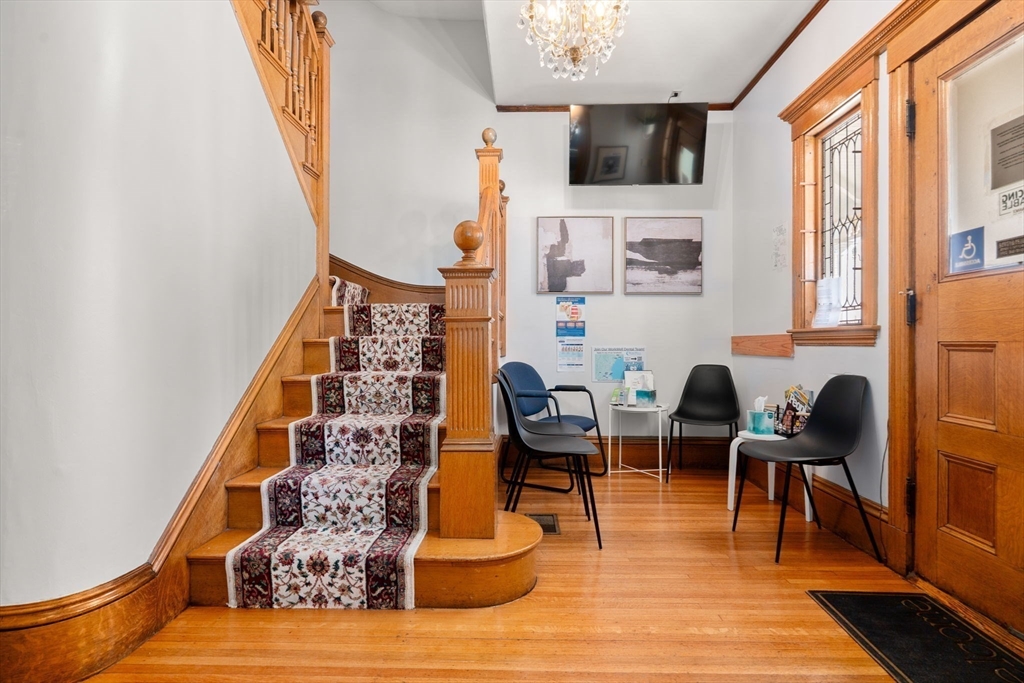 826 Broadway Everett, MA 02149 - Photo 23 of 41 a living room with furniture and a fireplace