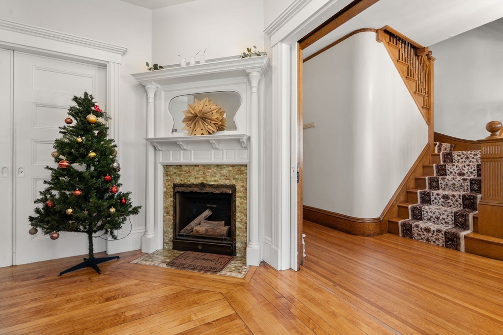 826 Broadway Everett, MA 02149 - Photo 24 of 41 a living room with furniture and a fireplace