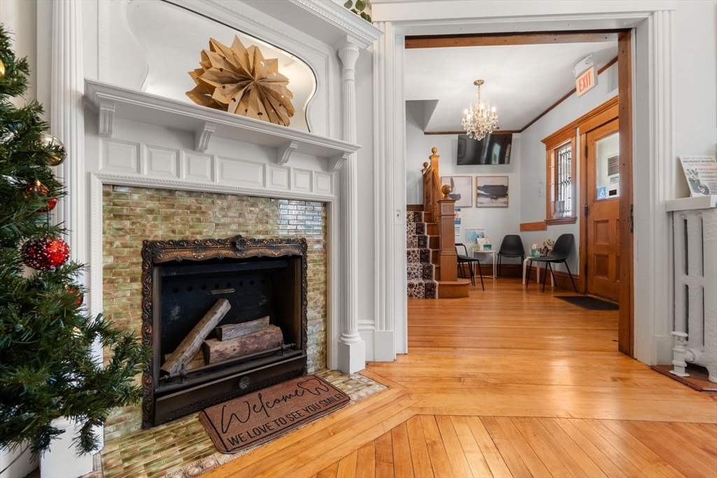 826 Broadway Everett, MA 02149 - Photo 25 of 41 a living room with furniture and a fireplace