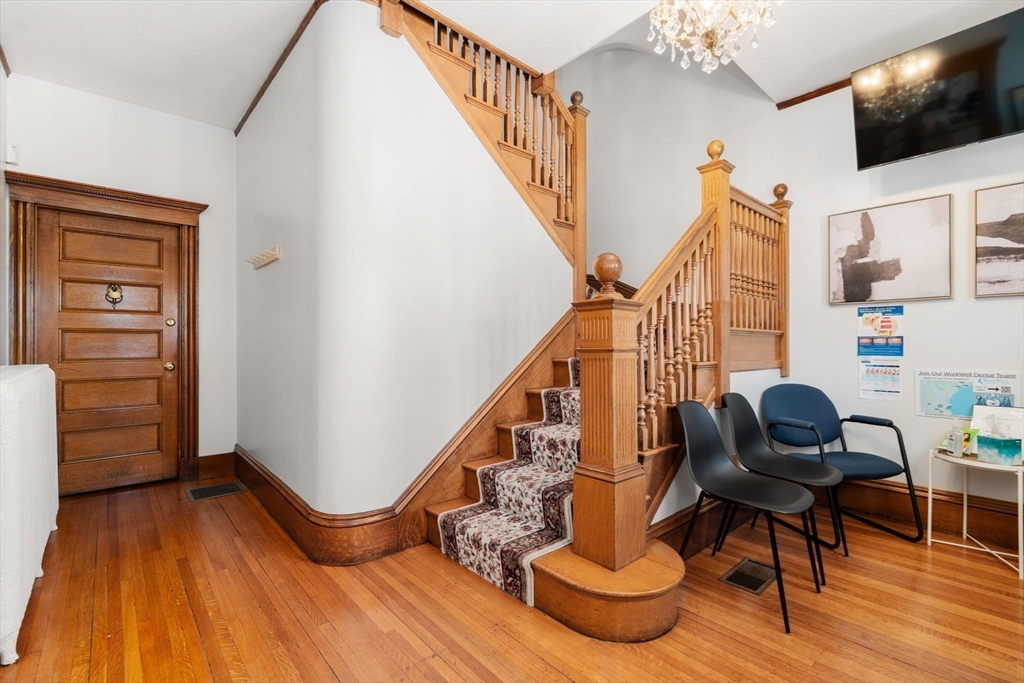 826 Broadway Everett, MA 02149 - Photo 26 of 41 a living room with furniture and a flat screen tv