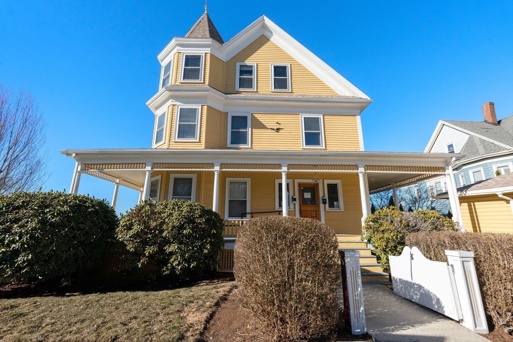 826 Broadway Everett, MA 02149 - Photo 27 of 41 a front view of a house with a garden