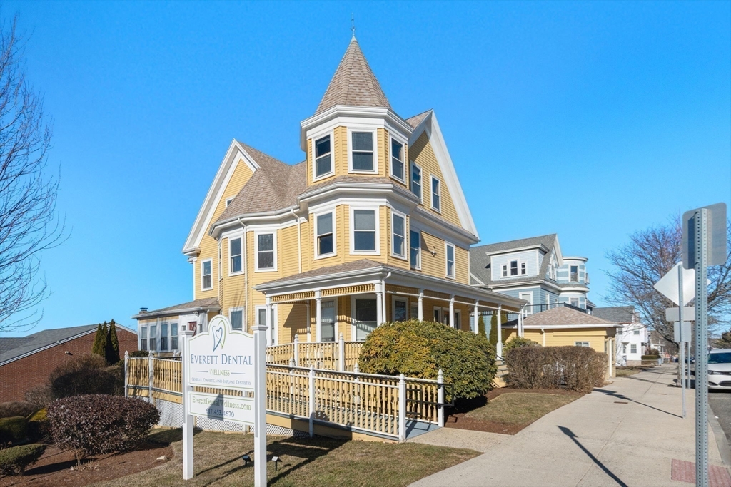 826 Broadway Everett, MA 02149 - Photo 29 of 41 a front view of a house with a yard