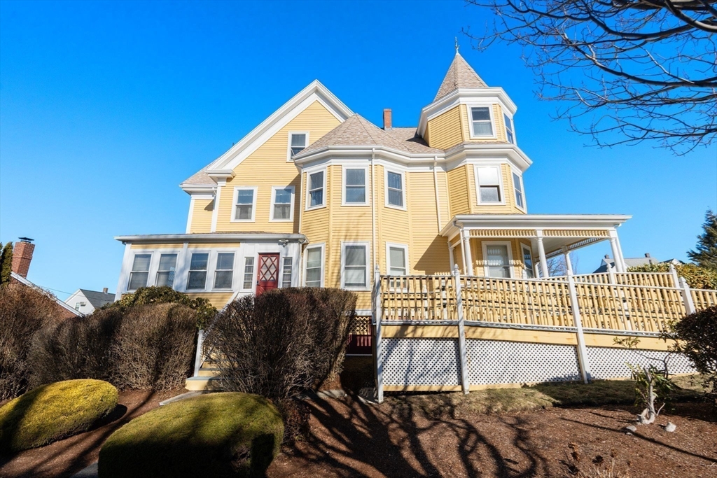 826 Broadway Everett, MA 02149 - Photo 33 of 41 a front view of a house with a yard