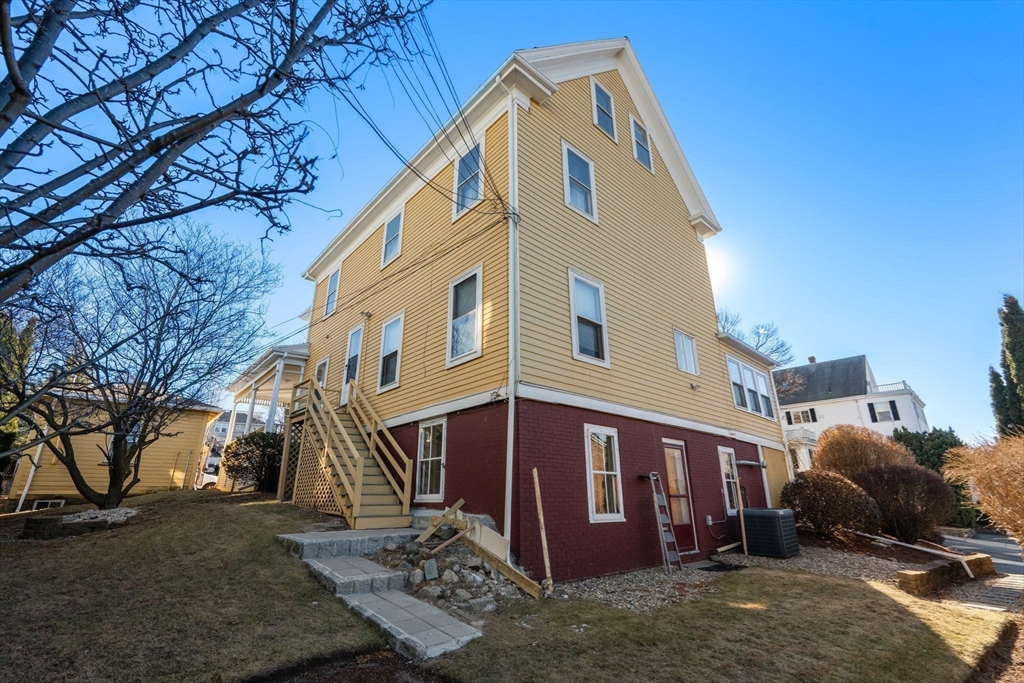 826 Broadway Everett, MA 02149 - Photo 34 of 41 a view of a house with a yard