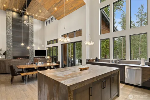 a kitchen with stainless steel appliances granite countertop a sink and a stove