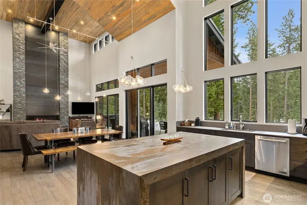 a kitchen with stainless steel appliances granite countertop a sink and a stove