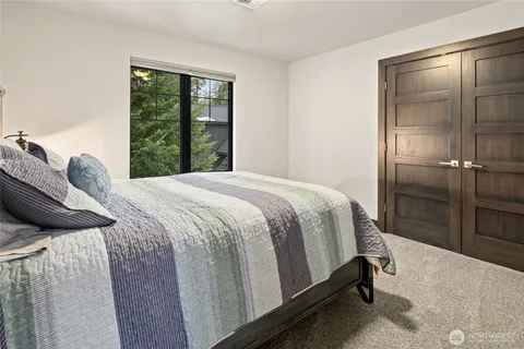 a bed room with a bed and furniture