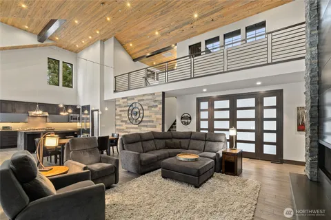 a media room with lots of chairs and a rug