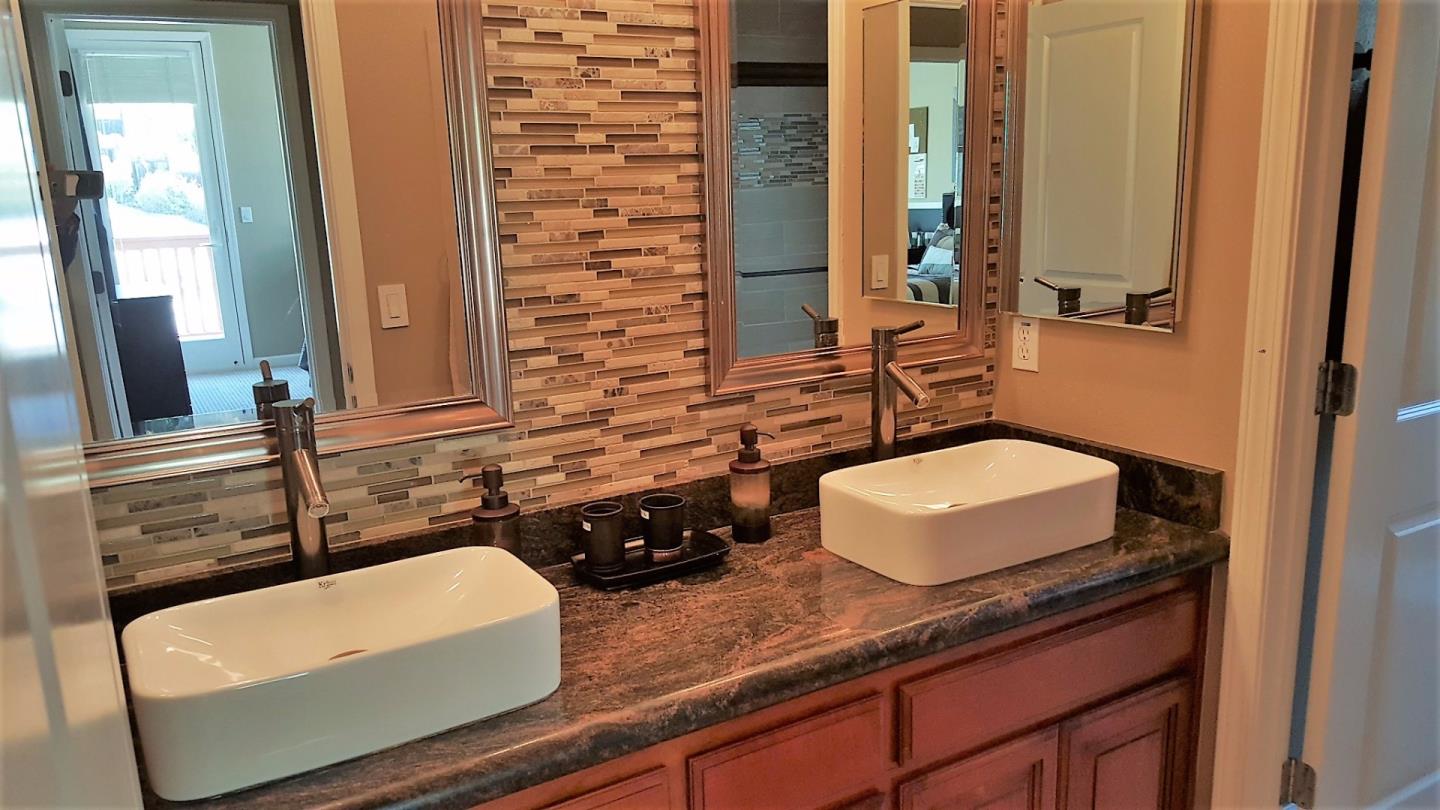 7271 Eagle Ridge Drive Gilroy, CA 95020 - Photo 16 of 17 a bathroom with a granite countertop sink and a mirror