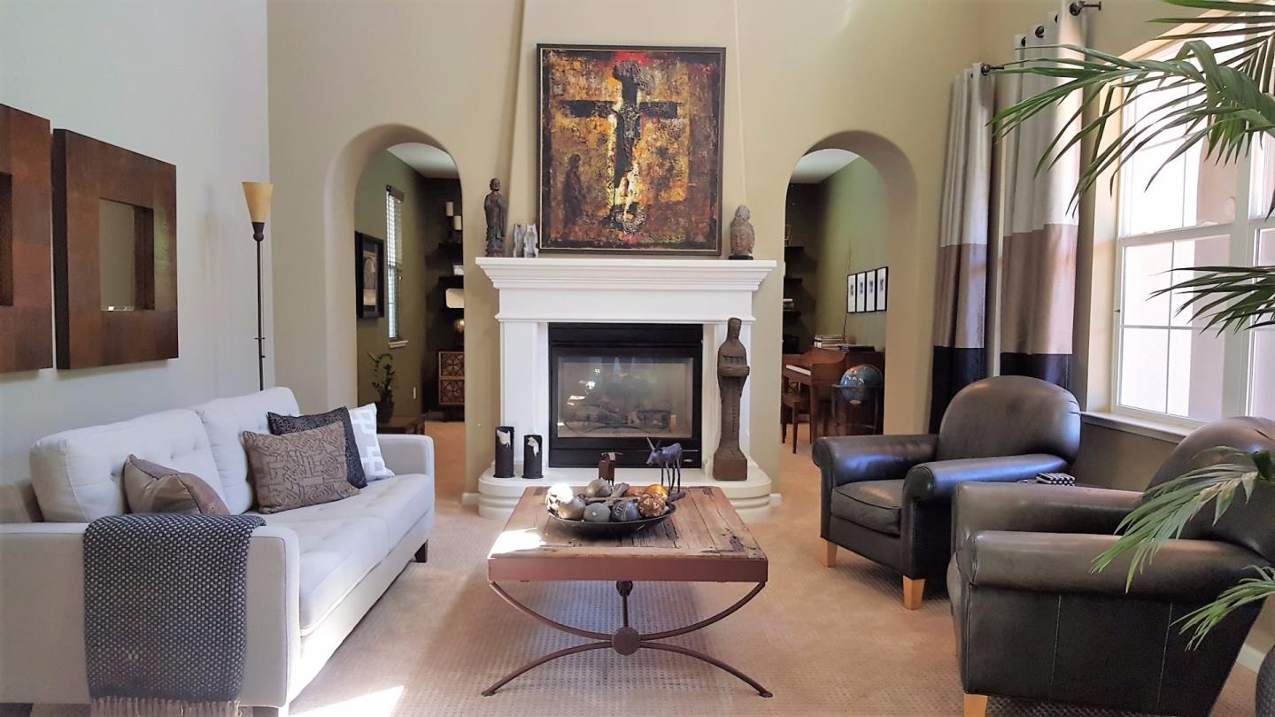 7271 Eagle Ridge Drive Gilroy, CA 95020 - Photo 4 of 17 a living room with furniture and a fireplace
