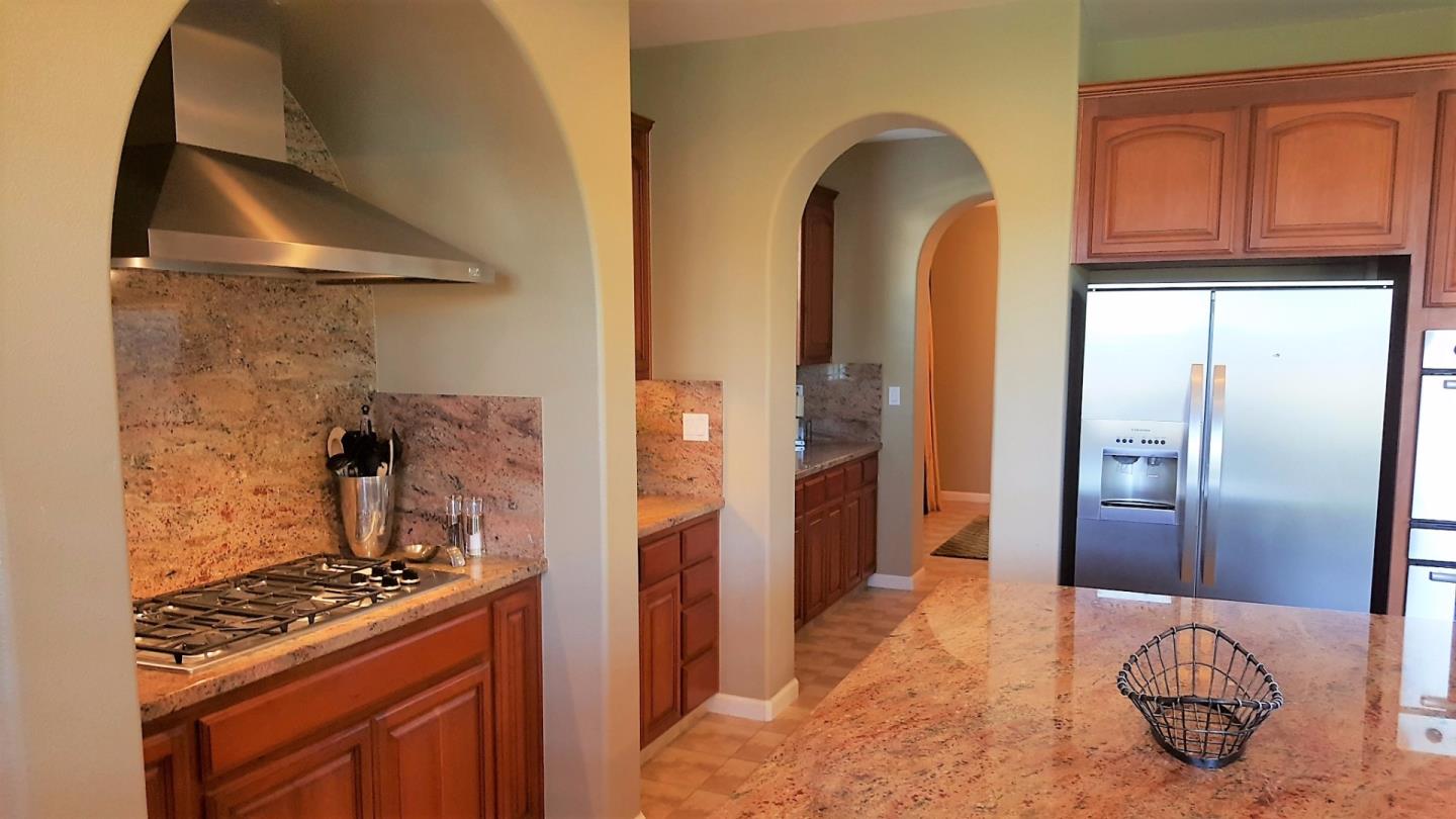 7271 Eagle Ridge Drive Gilroy, CA 95020 - Photo 10 of 17 a kitchen with stainless steel appliances granite countertop a refrigerator and a stove