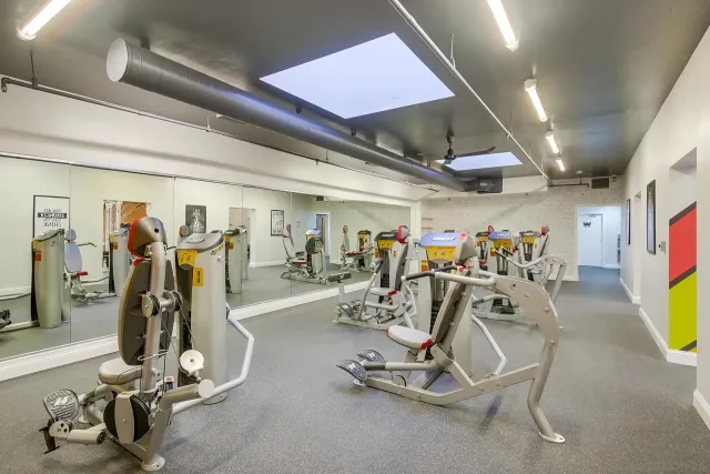 a kitchen with stainless steel appliances granite countertop a refrigerator and a stove