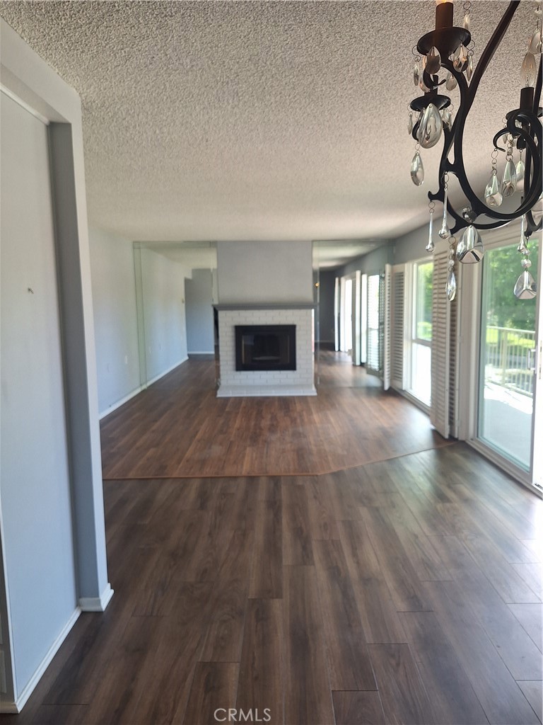 2139-unit A Ronda Granada, Unit A Laguna Woods, CA 92637 - Photo 4 of 8 wooden floor in an empty room with a window