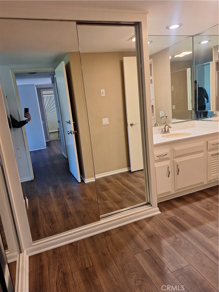2139-unit A Ronda Granada, Unit A Laguna Woods, CA 92637 - Photo 6 of 8 a bathroom with a sink a mirror and a shower