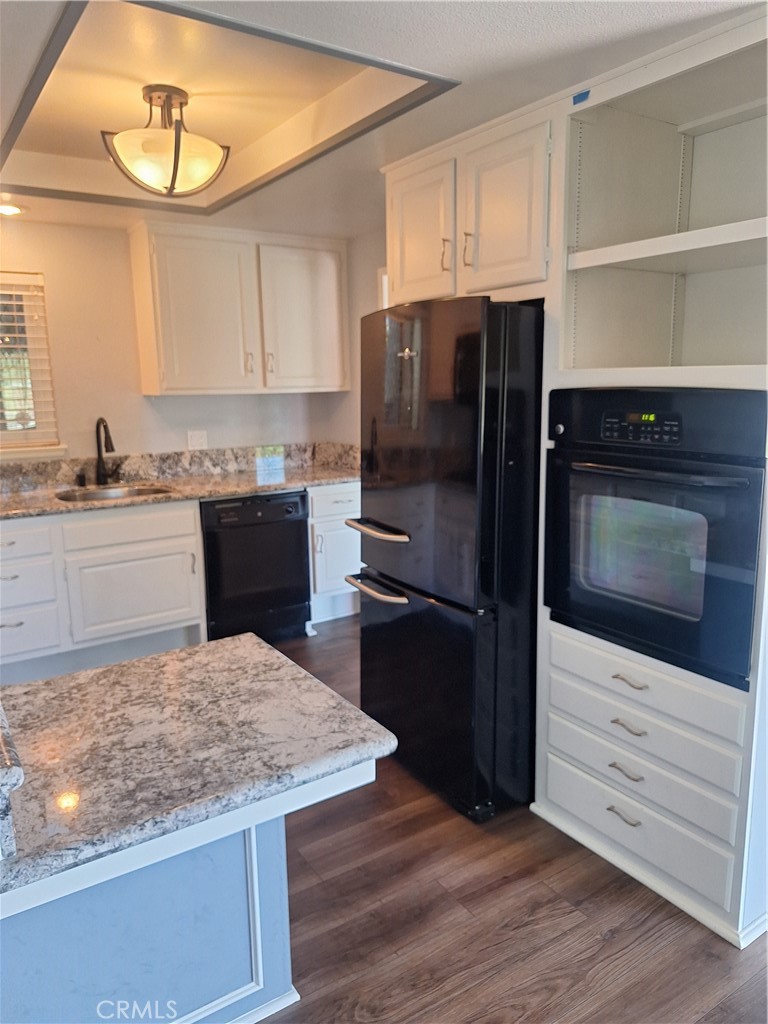 2139-unit A Ronda Granada, Unit A Laguna Woods, CA 92637 - Photo 8 of 8 a kitchen with a refrigerator and a stove top oven