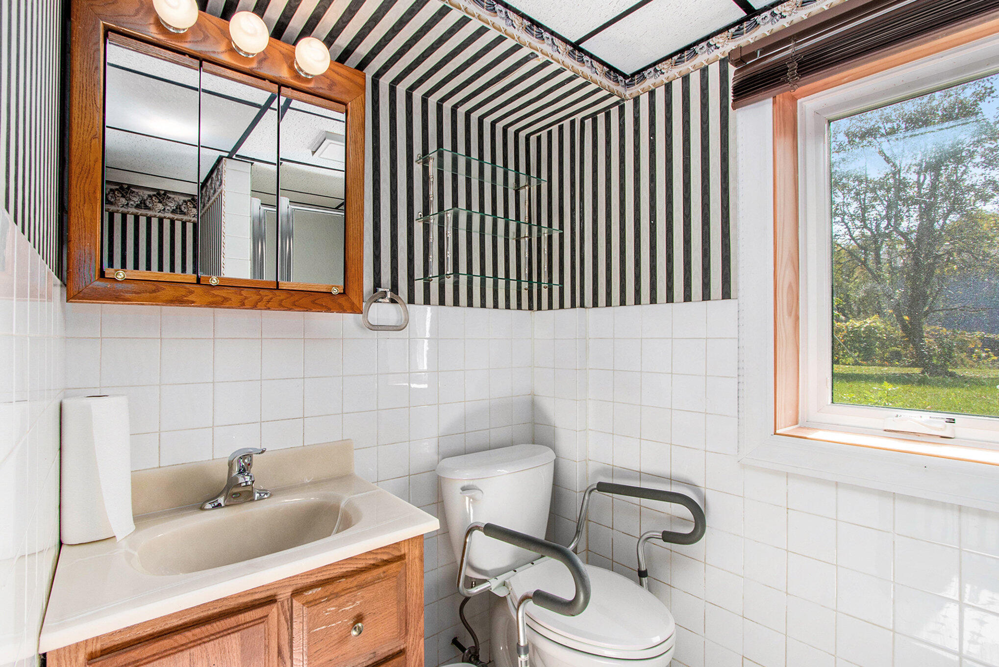 1803 West 95th Court Crown Point, IN 46307 - Photo 14 of 26 a bathroom with a toilet sink mirror and tub