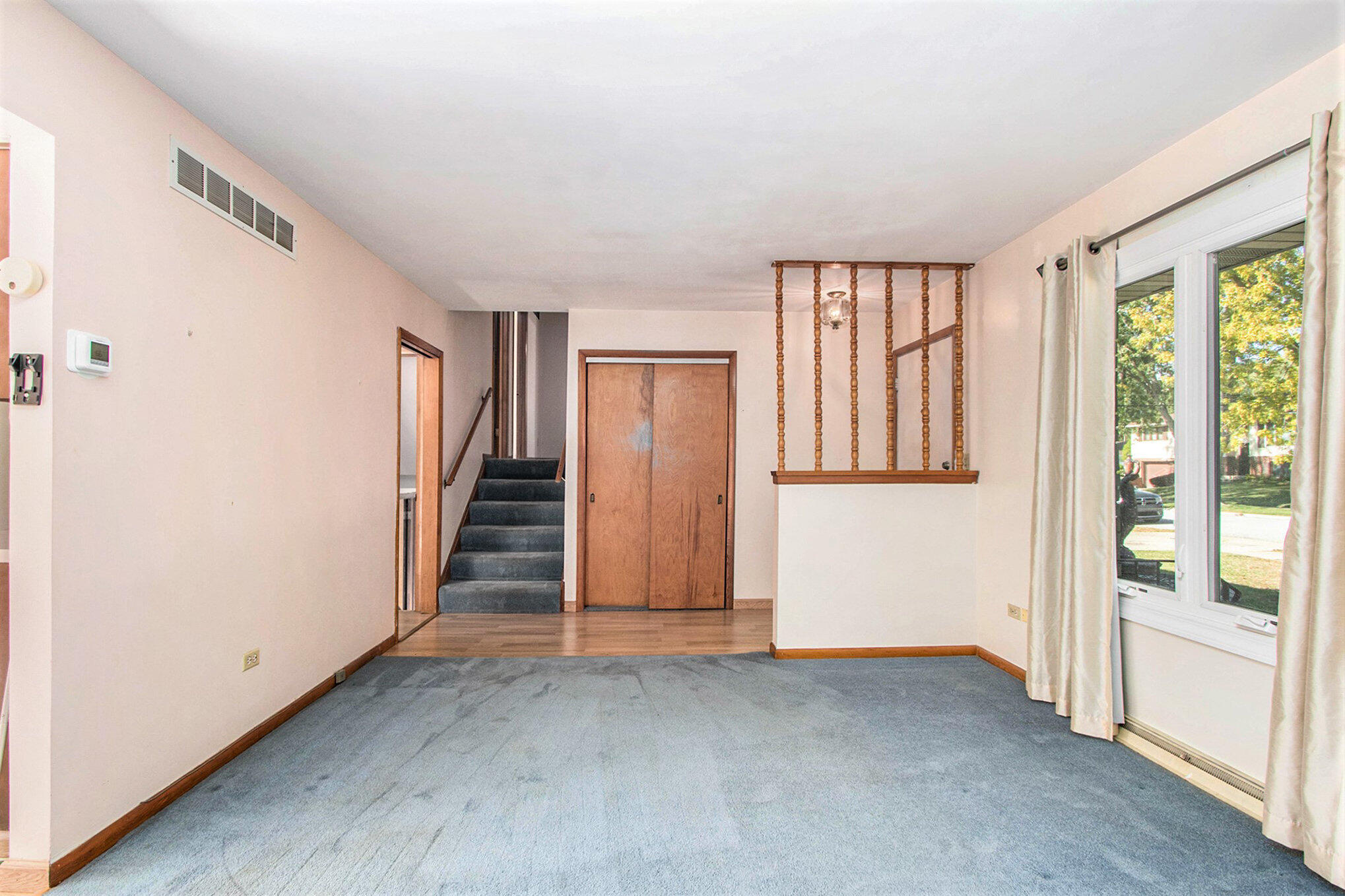1803 West 95th Court Crown Point, IN 46307 - Photo 19 of 26 a view of entryway with wooden floor and stairs