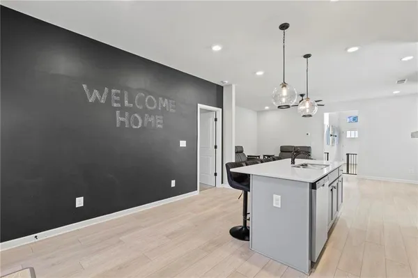 a kitchen with a stove a refrigerator and a fireplace