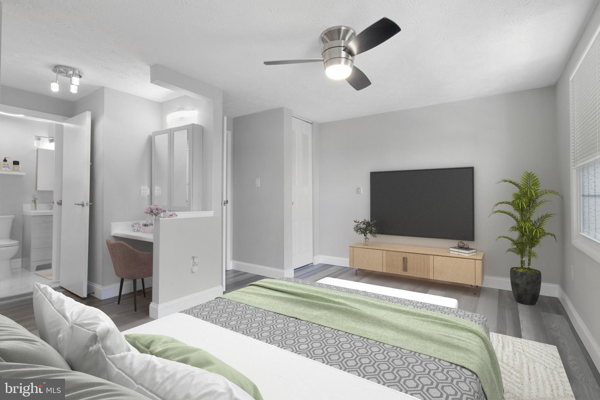 1456 Farmcrest Way Silver Spring, MD 20905 - Photo 11 of 24 a bedroom with a bed and a flat screen tv