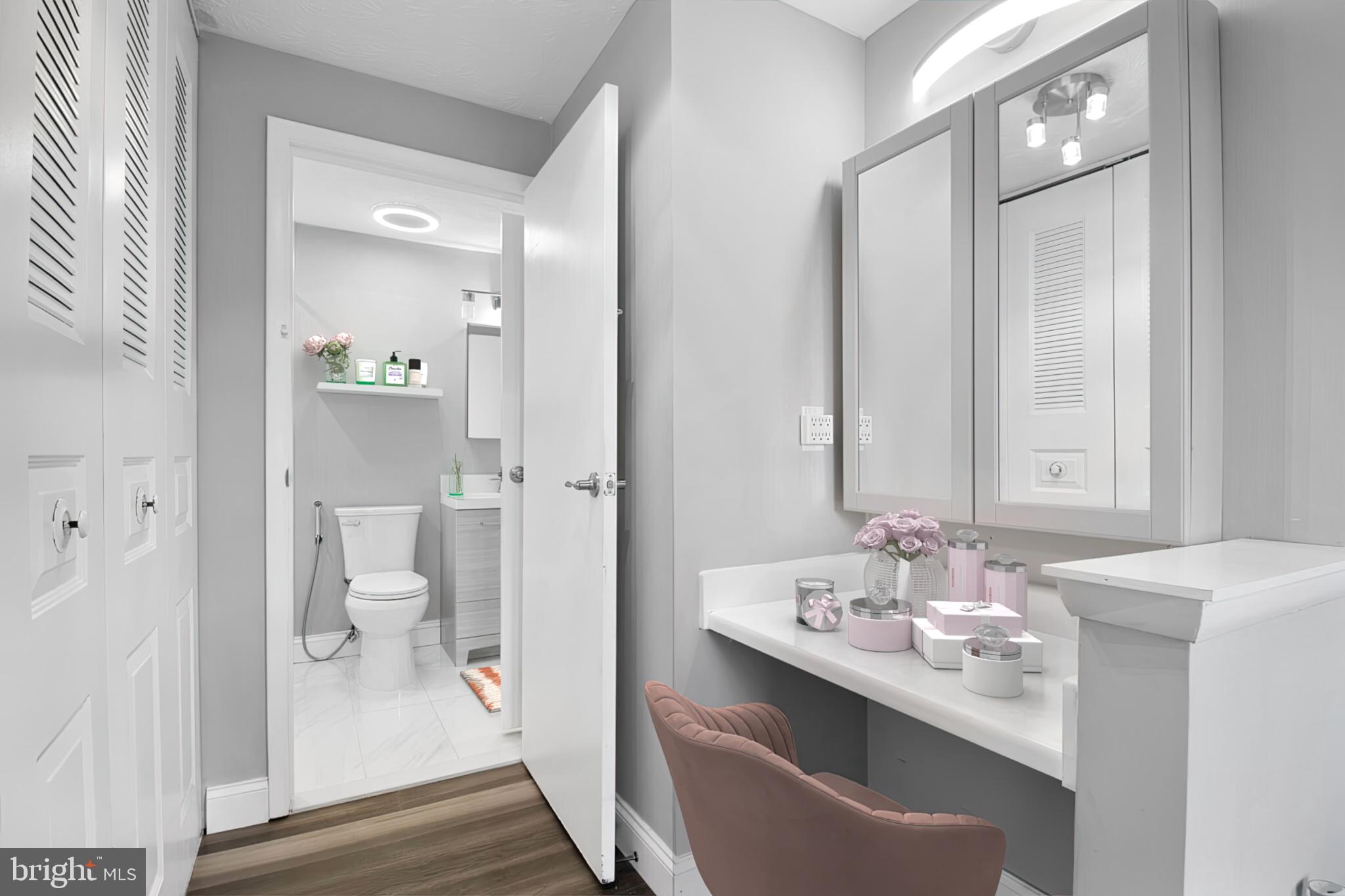 1456 Farmcrest Way Silver Spring, MD 20905 - Photo 12 of 24 a en suite bathroom with a sink mirror and toilet