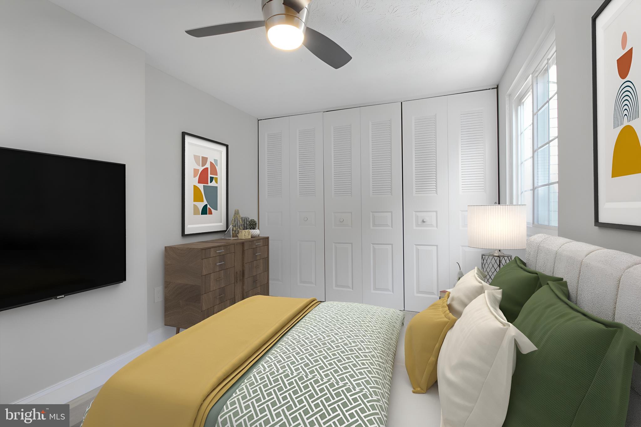 1456 Farmcrest Way Silver Spring, MD 20905 - Photo 14 of 24 a bedroom with a bed and a flat screen tv