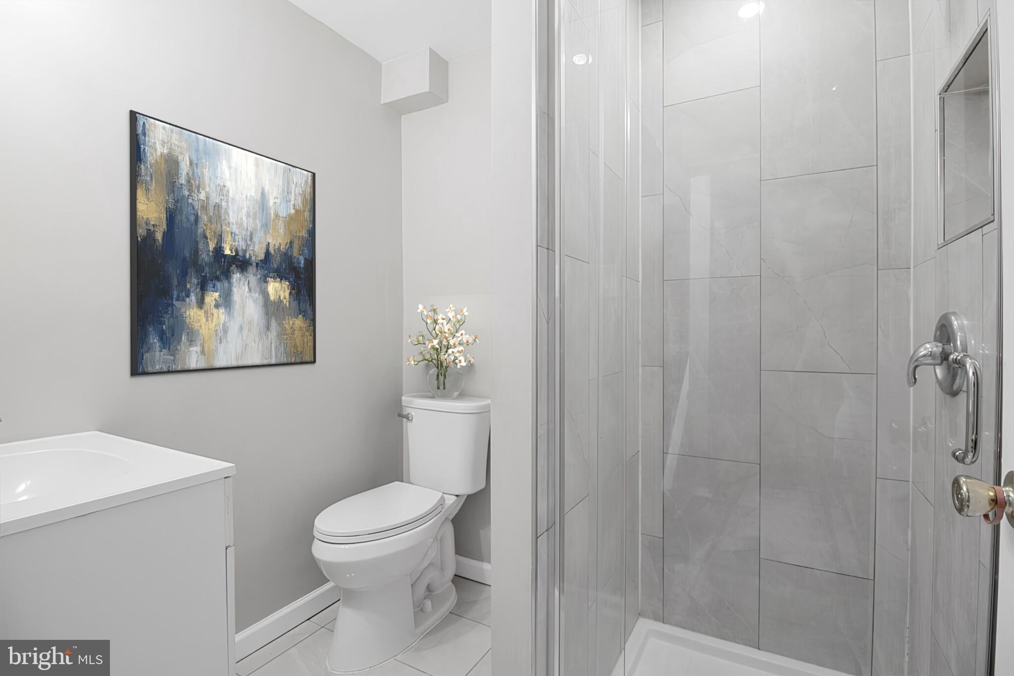 1456 Farmcrest Way Silver Spring, MD 20905 - Photo 18 of 24 a bathroom with a toilet a sink and view of bathroom