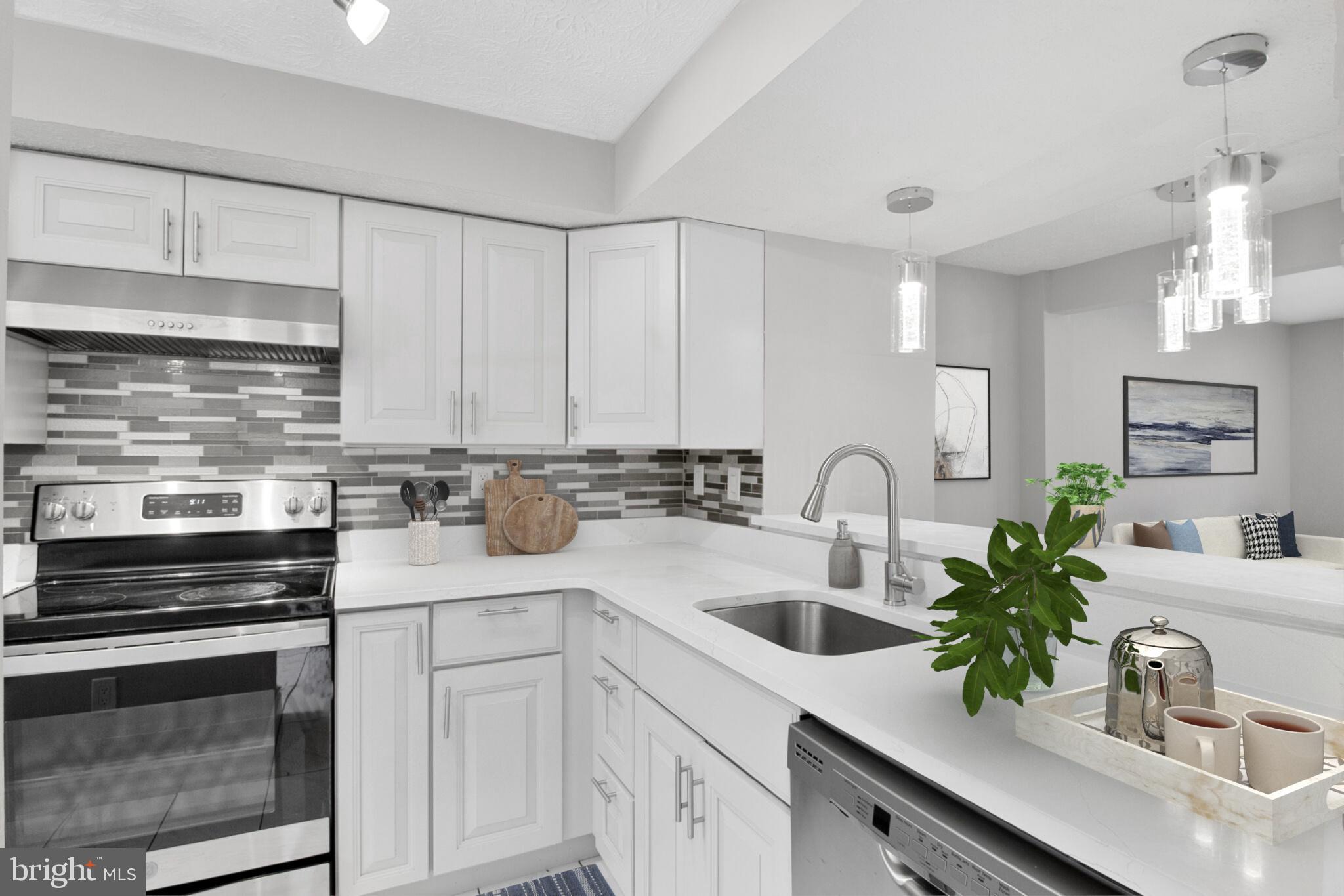 1456 Farmcrest Way Silver Spring, MD 20905 - Photo 2 of 24 a kitchen with sink a microwave and cabinets