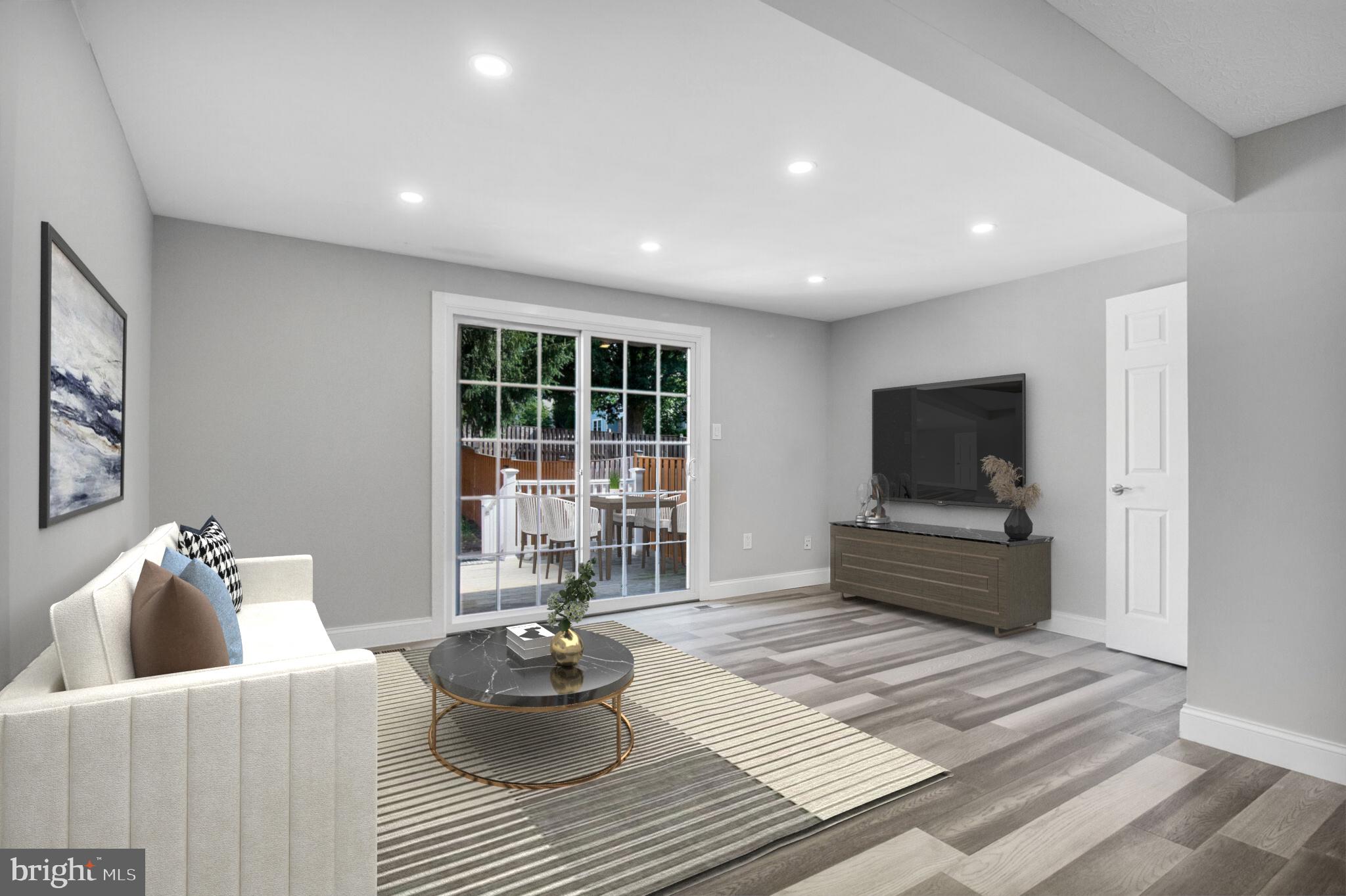 1456 Farmcrest Way Silver Spring, MD 20905 - Photo 6 of 24 a living room with furniture and a flat screen tv