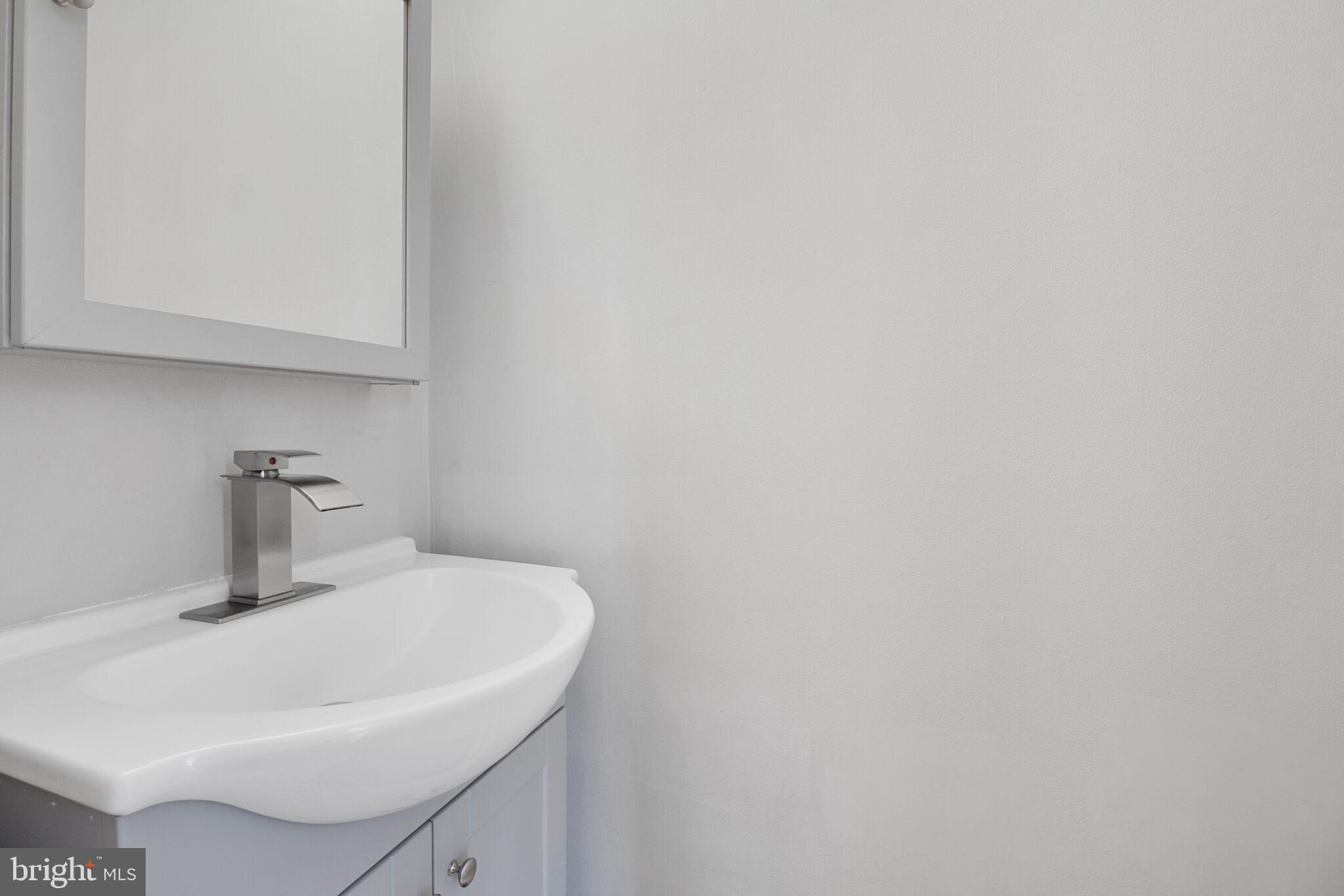 1456 Farmcrest Way Silver Spring, MD 20905 - Photo 8 of 24 a bathroom with a sink