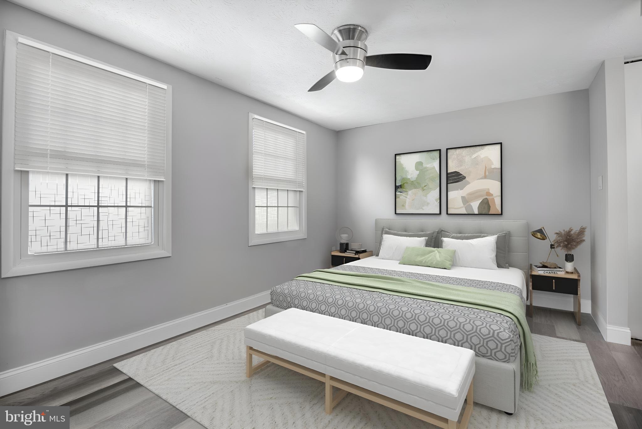 1456 Farmcrest Way Silver Spring, MD 20905 - Photo 9 of 24 a bedroom with a large bed and a chandelier