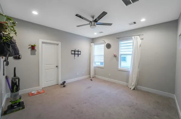a bathroom with a tub a sink and a large mirror