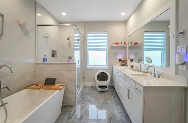 a bathroom with a bathtub and a sink