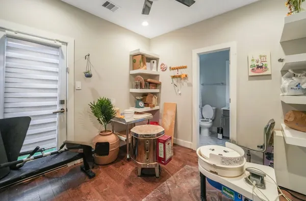 a white toilet sitting next to a bath tub