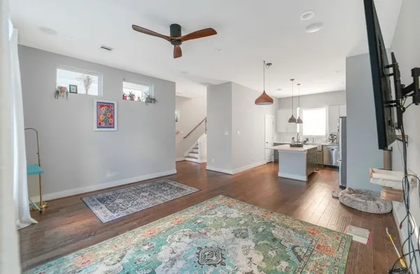a view of kitchen with furniture and wooden floor