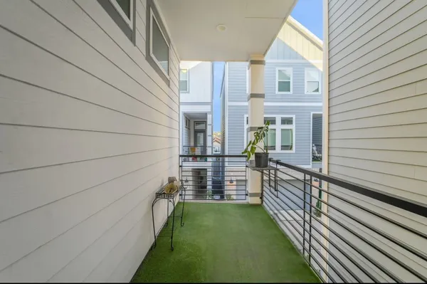 a view of two chairs in the balcony