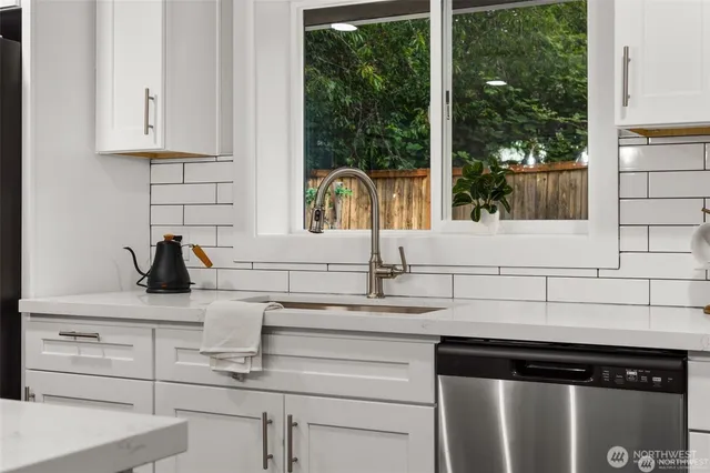 a kitchen with a sink and a window