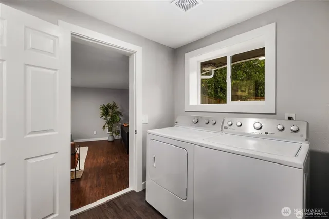 a view of bathroom with a sink and a window