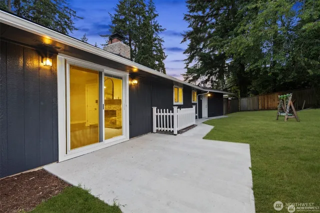 a view of a house with a backyard