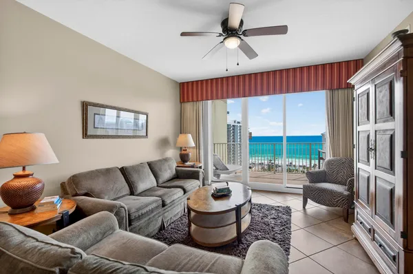 a living room with furniture and a large window