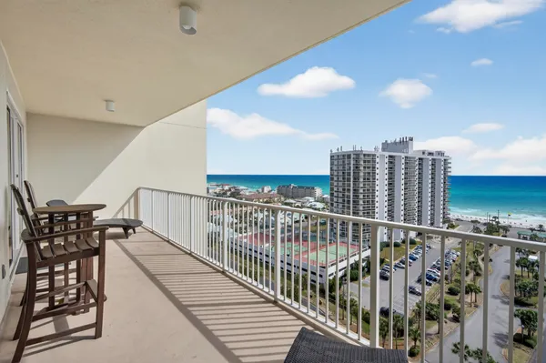 a view of a balcony with furniture