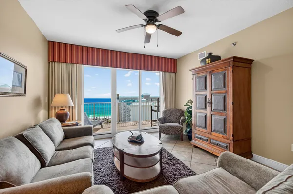 a living room with furniture and a large window
