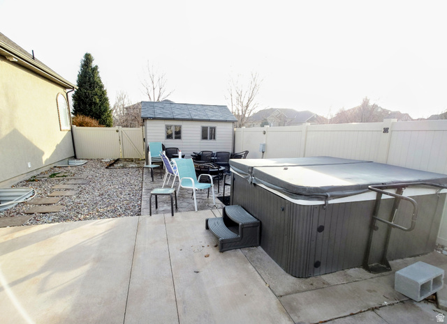 552 Sunset Crest Way Draper, UT 84020 - Photo 68 of 68 Fenced backyard featuring a patio area, a gate, an outbuilding, and outdoor dining area