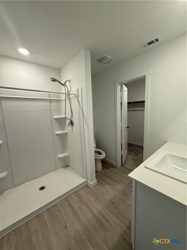 3230 Mound Ridge New Braunfels, TX 78130 - Photo 13 of 15 a bathroom with a shower and a glass door